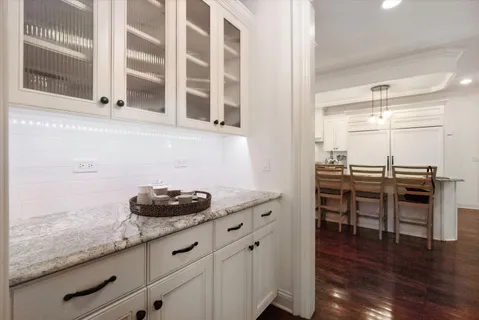 a kitchen with a sink and cabinets
