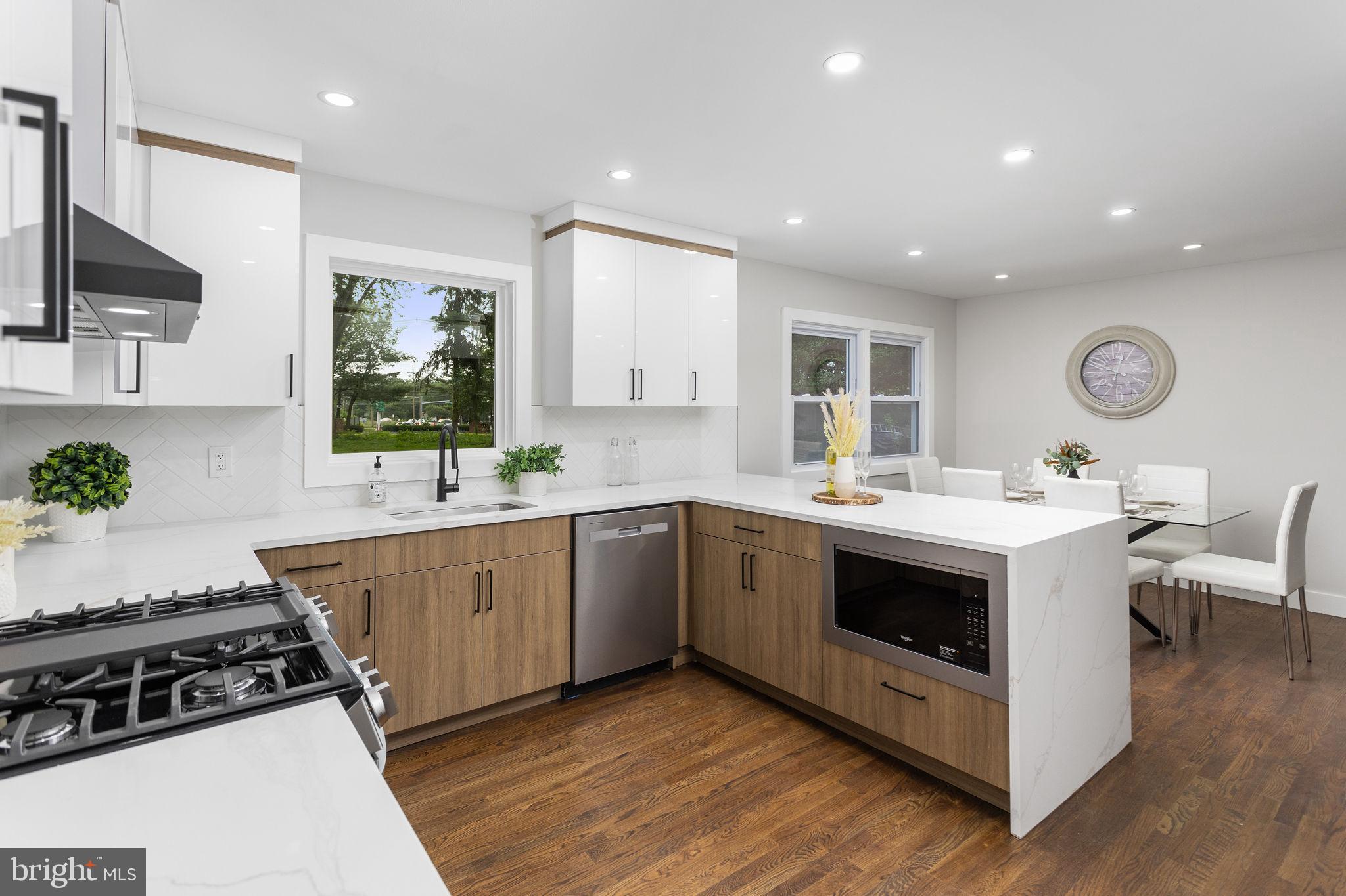 6 Ryan Road Cranbury, NJ 08512 - Photo 11 of 44 a kitchen with a sink and a stove top oven