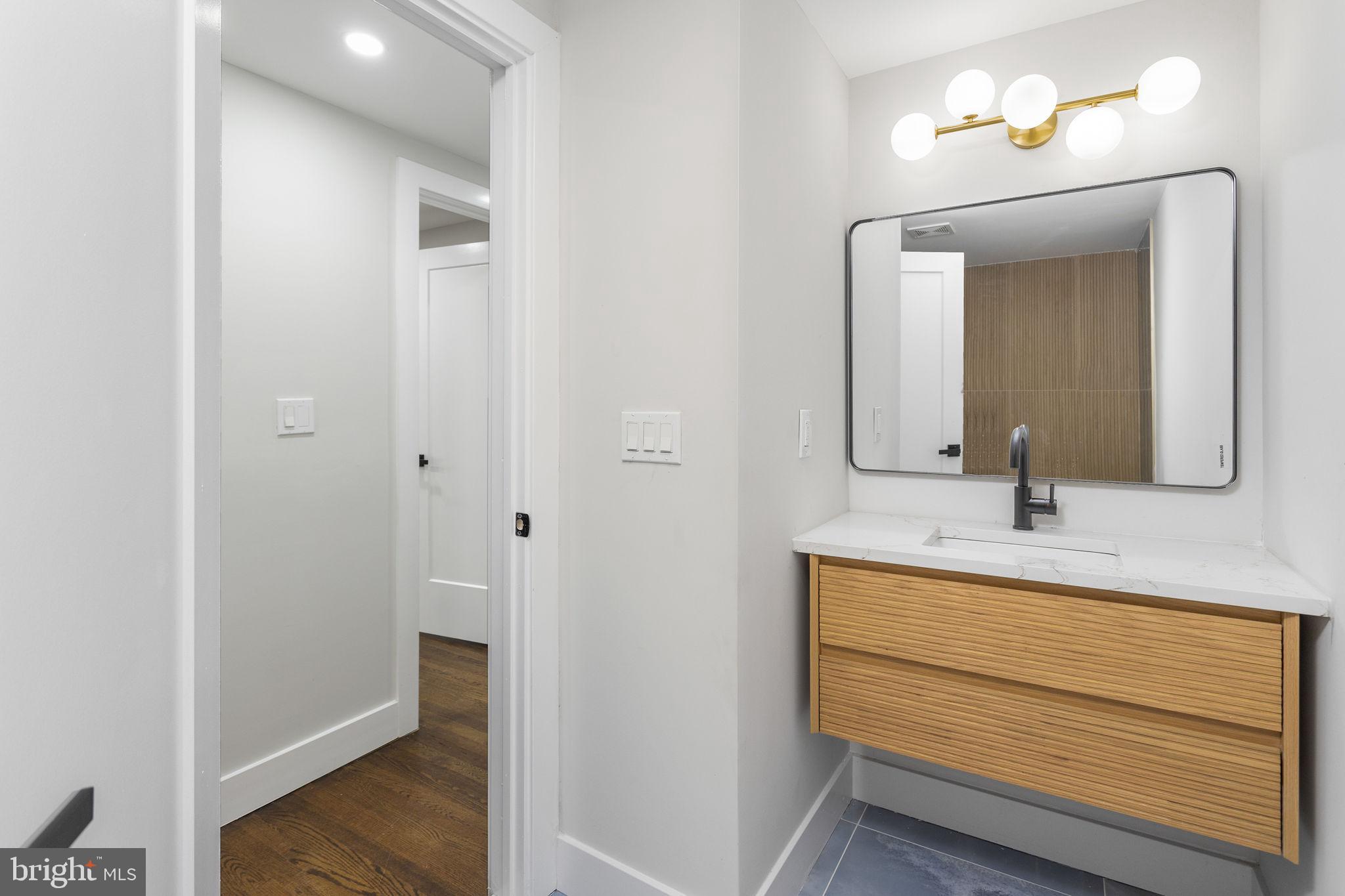 6 Ryan Road Cranbury, NJ 08512 - Photo 19 of 44 a bathroom with a sink and a mirror