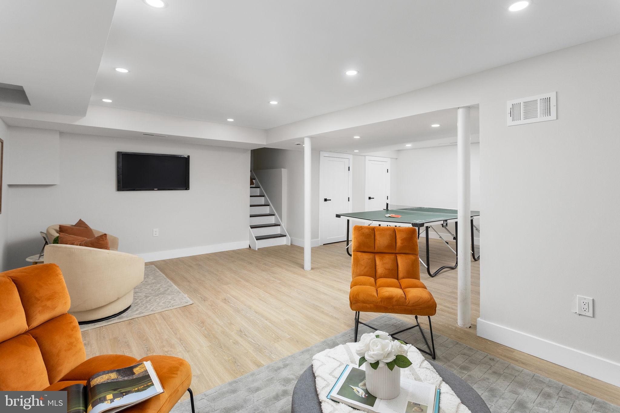 6 Ryan Road Cranbury, NJ 08512 - Photo 27 of 44 a living room with furniture and a flat screen tv