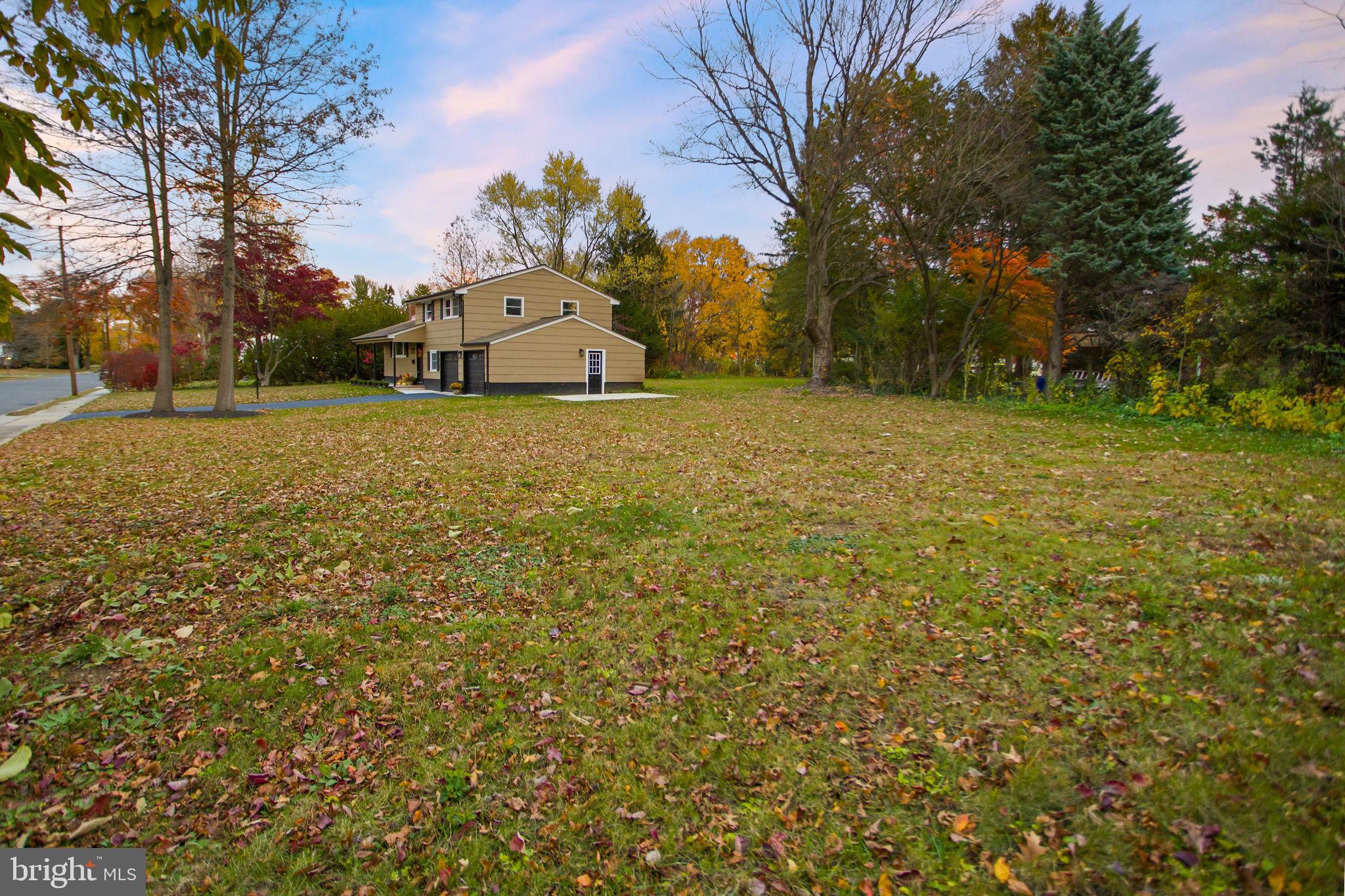 6 Ryan Road Cranbury, NJ 08512 - Photo 37 of 44 a front view of a house with a yard