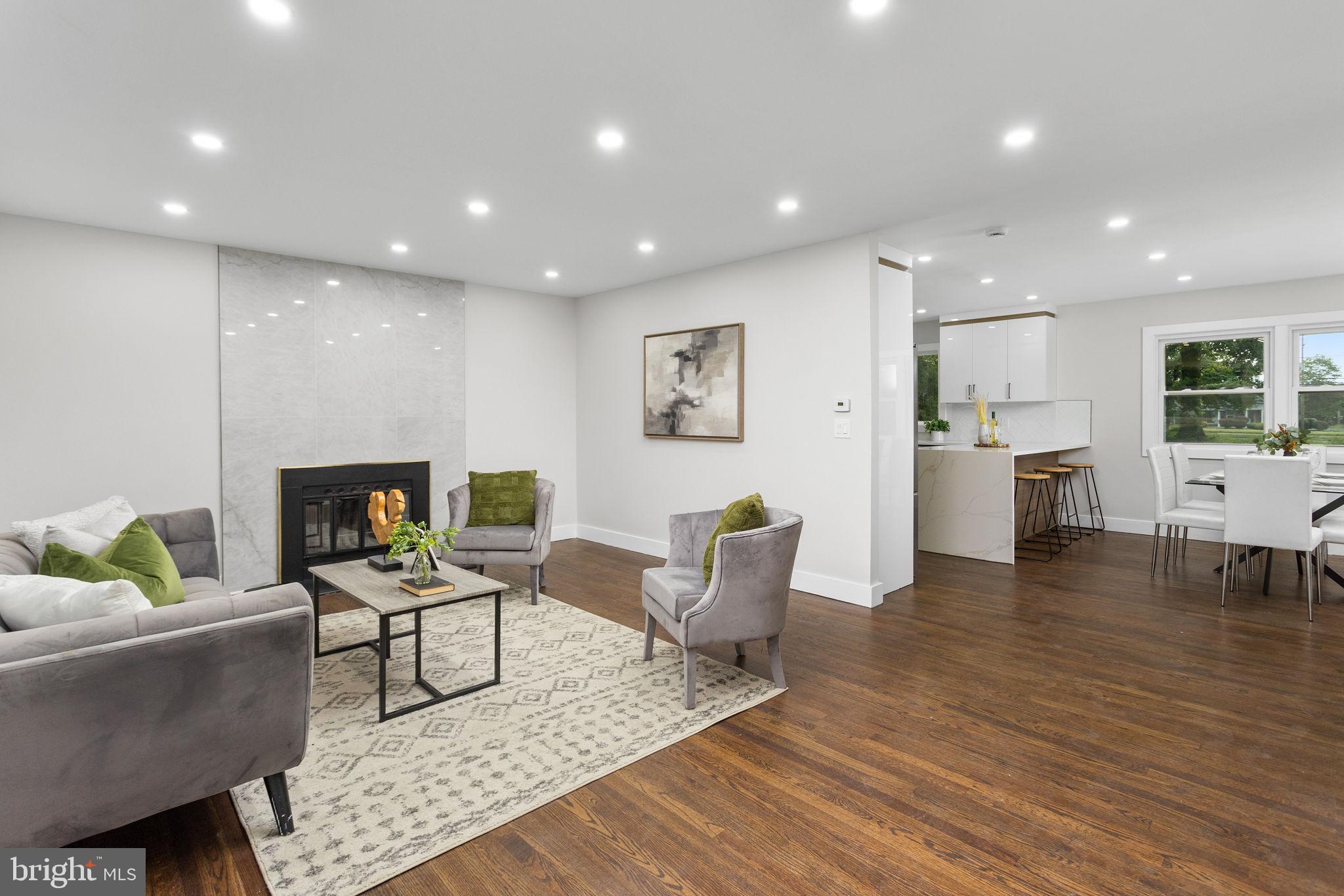 6 Ryan Road Cranbury, NJ 08512 - Photo 5 of 44 a living room with furniture and a fireplace