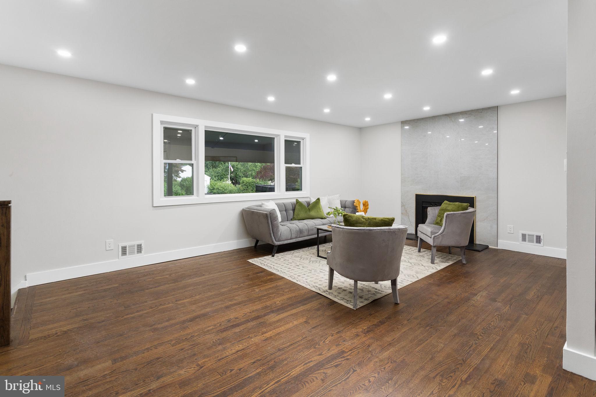 6 Ryan Road Cranbury, NJ 08512 - Photo 6 of 44 a living room with furniture and a fireplace