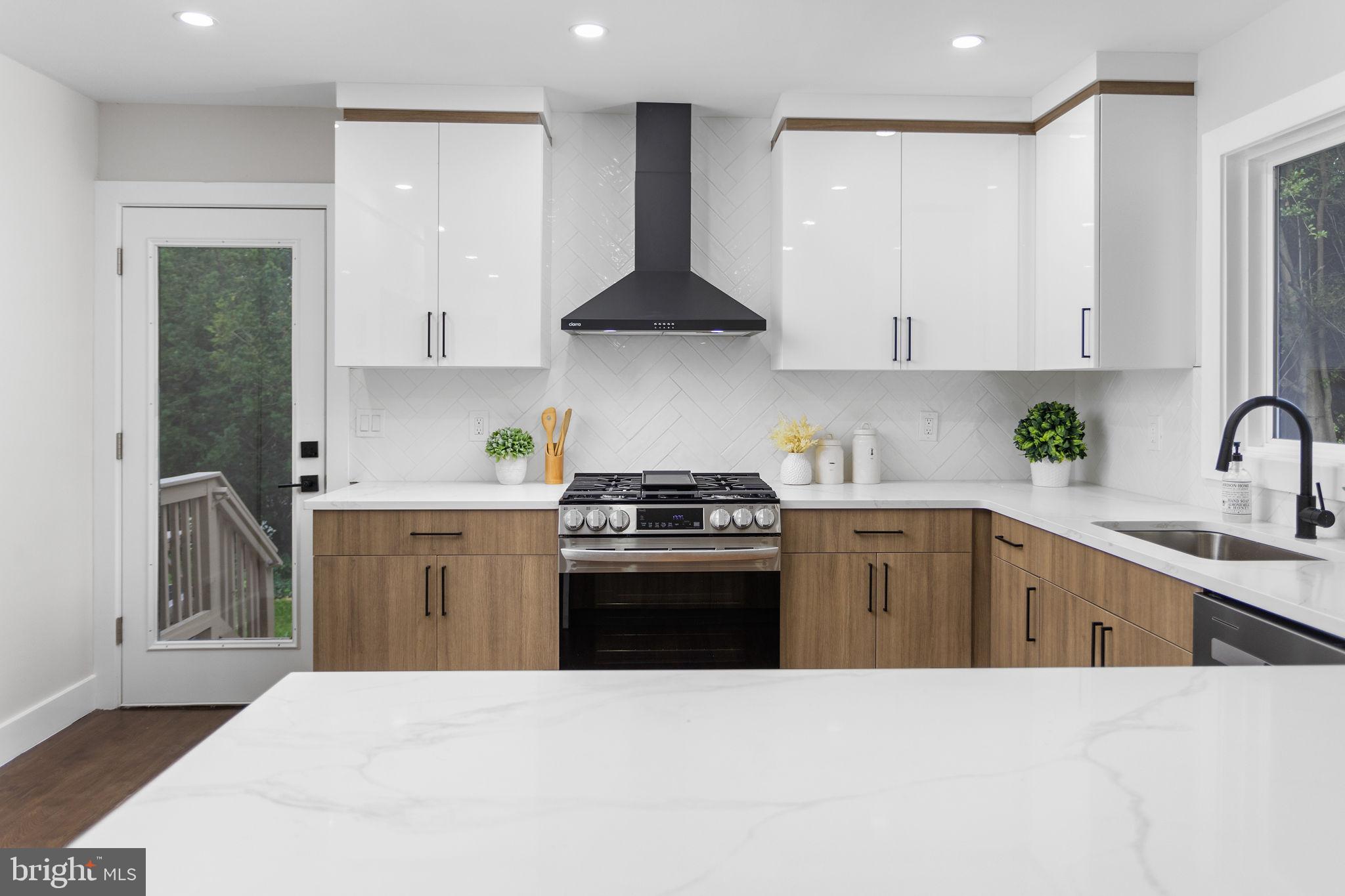6 Ryan Road Cranbury, NJ 08512 - Photo 9 of 44 a kitchen with stainless steel appliances a sink stove and cabinets