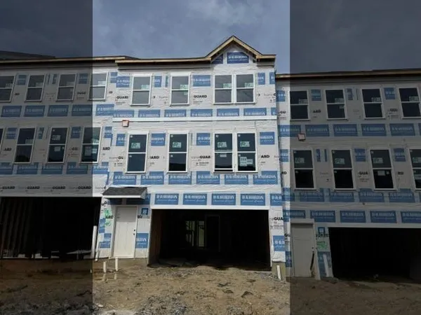 a front view of a building with a lot of windows