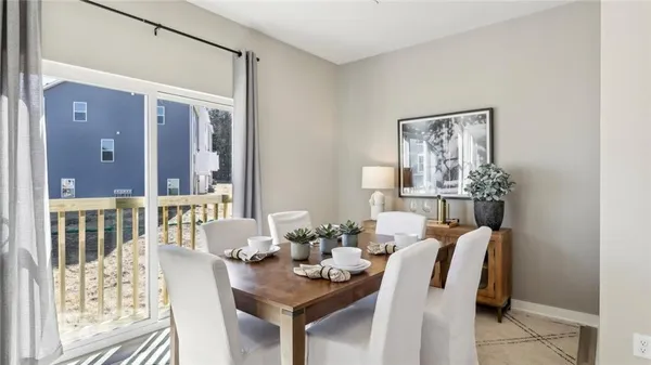 a view of a dining room with furniture window and outside view