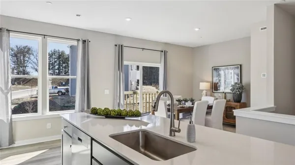 a kitchen with stainless steel appliances granite countertop a sink and stove