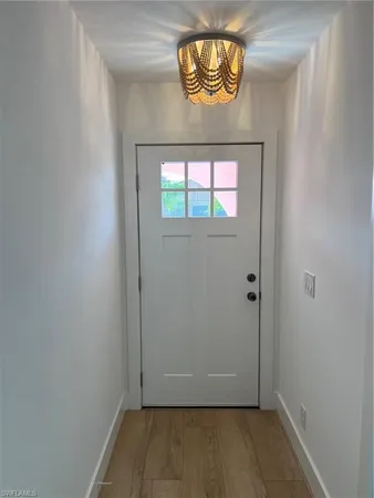 an empty room with wooden floor