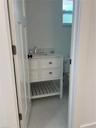 a bathroom with a sink and mirror