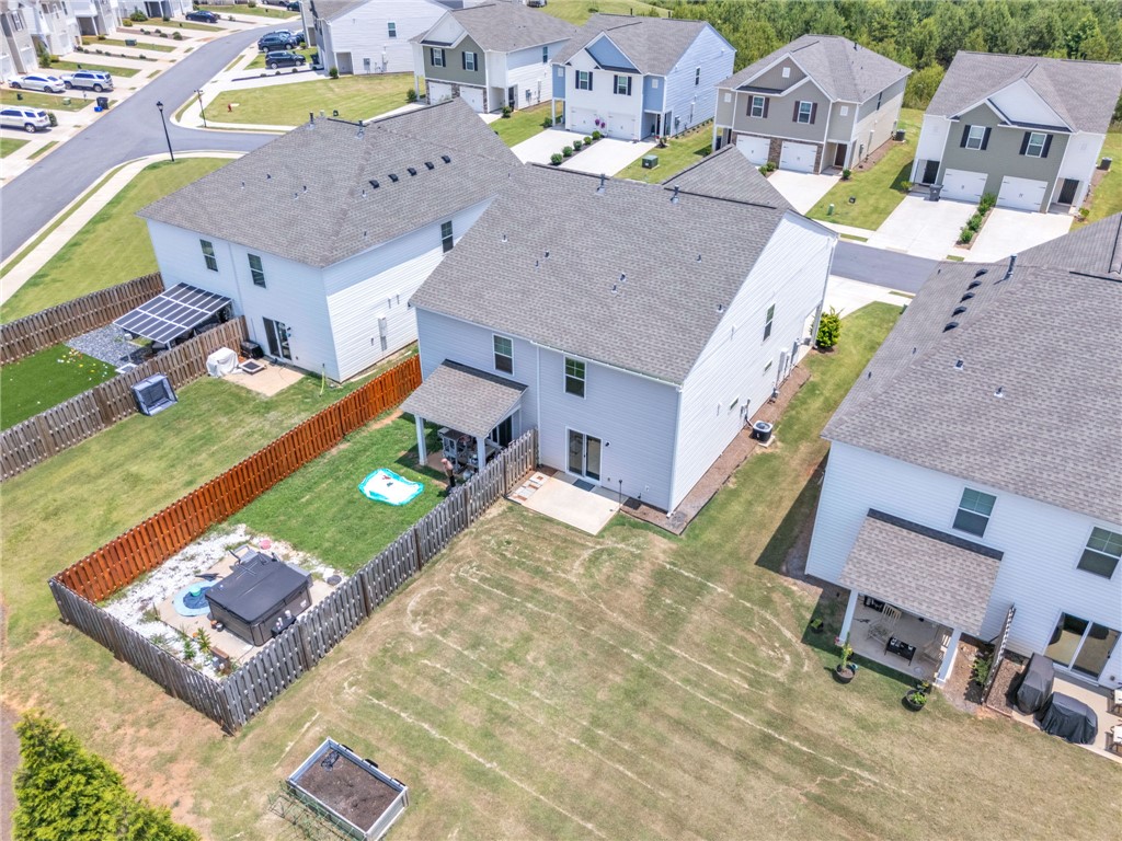 208 Samuel Street Pendleton, SC 29670 - Photo 30 of 32 An aerial perspective reveals a well-maintained neighborhood, showcasing neat yards and accessible community streets.