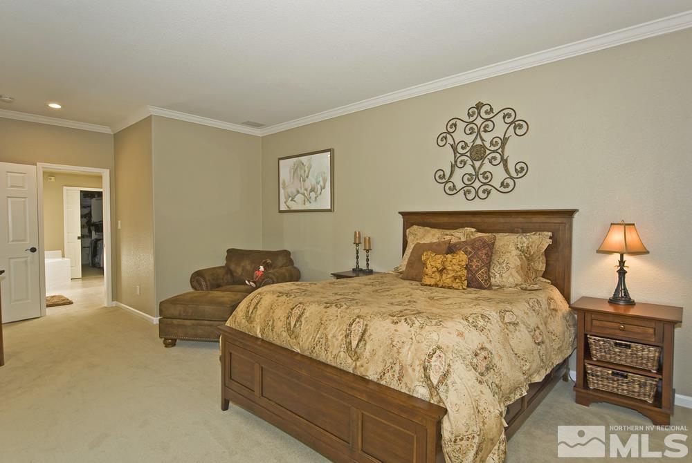 3960 Innsbruck Court Reno, NV 89519 - Photo 15 of 33 a bedroom with a bed and a lamp on dresser