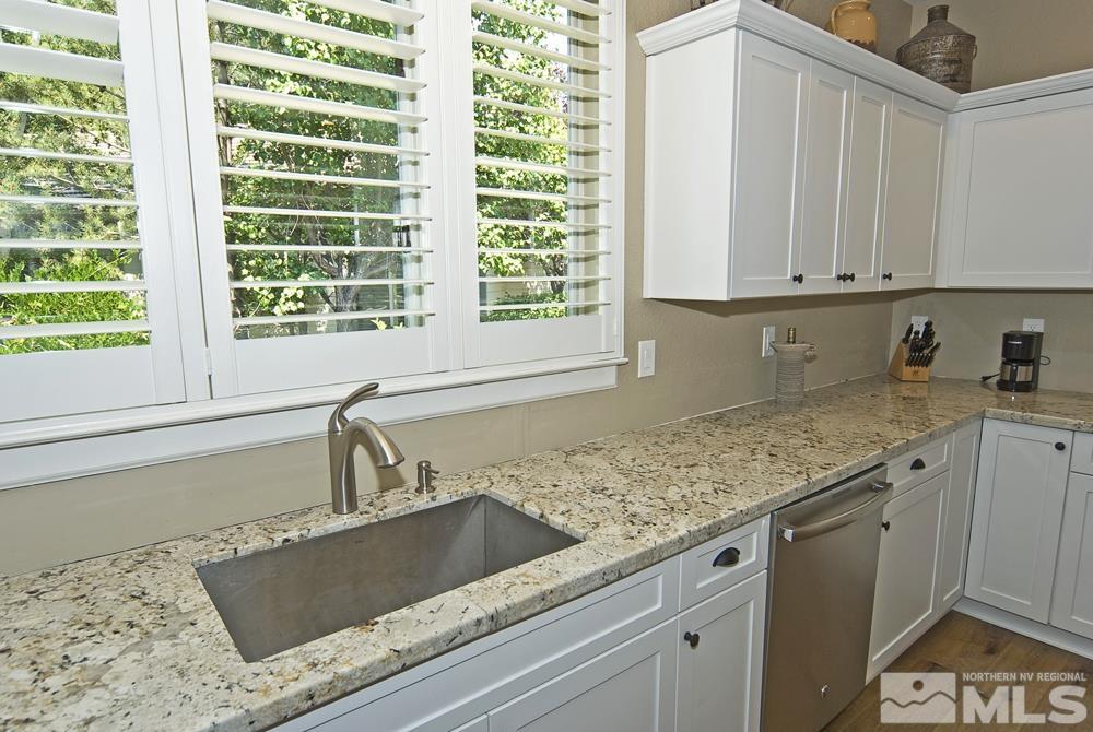 3960 Innsbruck Court Reno, NV 89519 - Photo 26 of 33 a kitchen with granite countertop a sink and a granite counter tops
