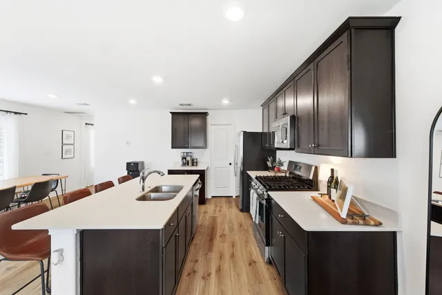 a kitchen with counter top space and stainless steel appliances