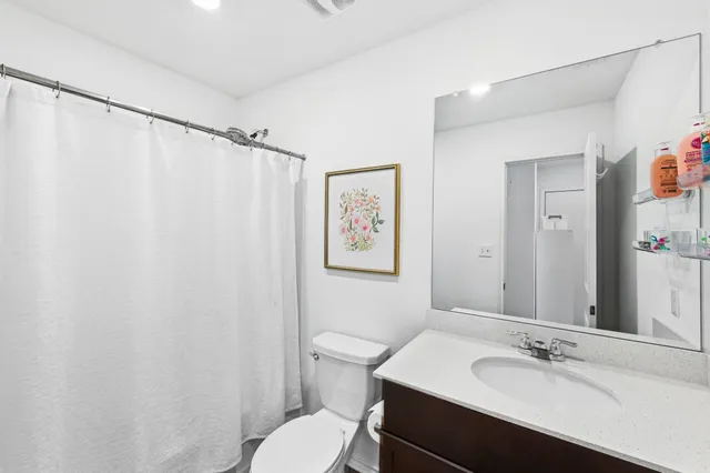 a bedroom with a bed chair and a window