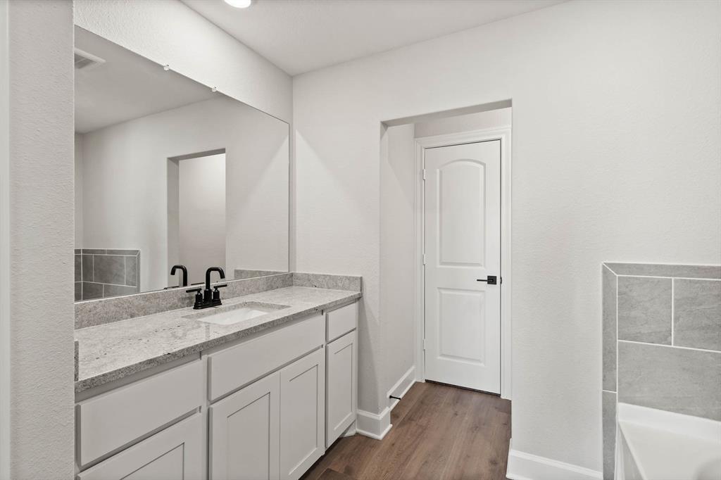 455 MB's Way Pilot Point, TX 76258 - Photo 6 of 8 a bathroom with a sink and a mirror