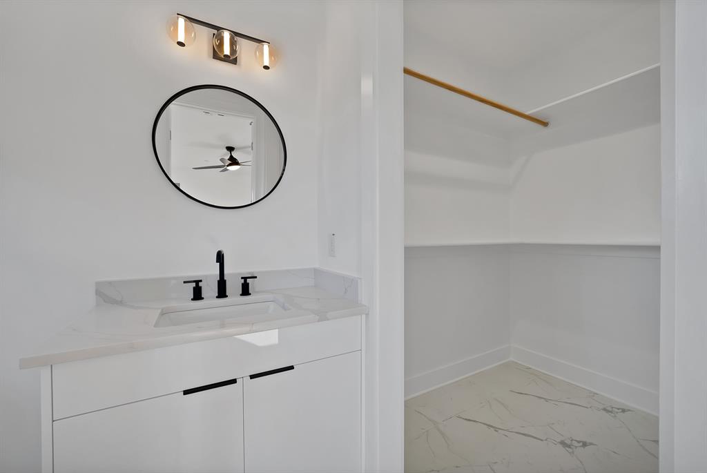 443 Whispering Way Red Oak, TX 75154 - Photo 26 of 36 a bathroom with a sink and a mirror