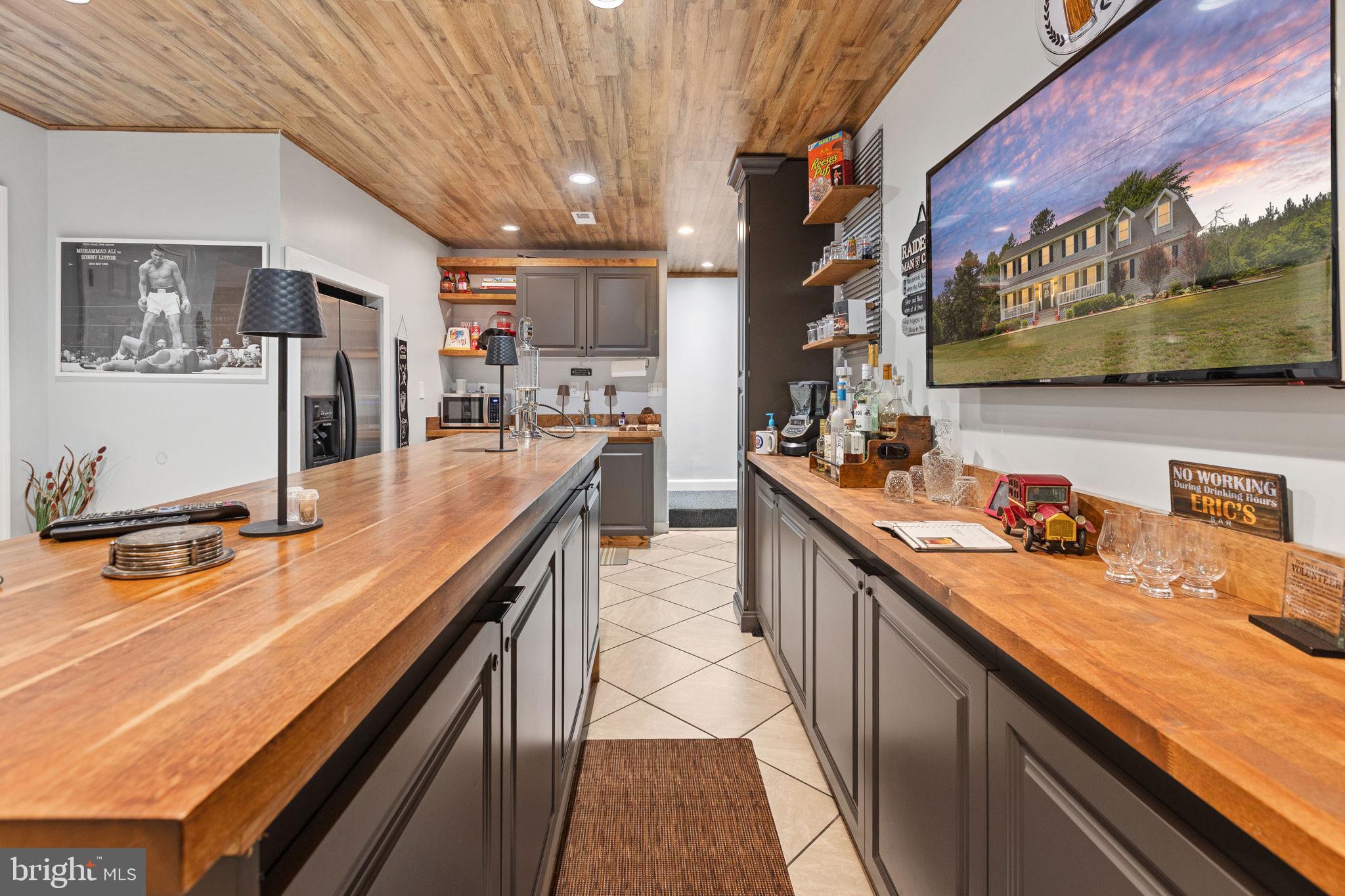 22088 Landora Bridge Road Ruther Glen, VA 22546 - Photo 80 of 122 Stylish kitchen with warm wood accents.