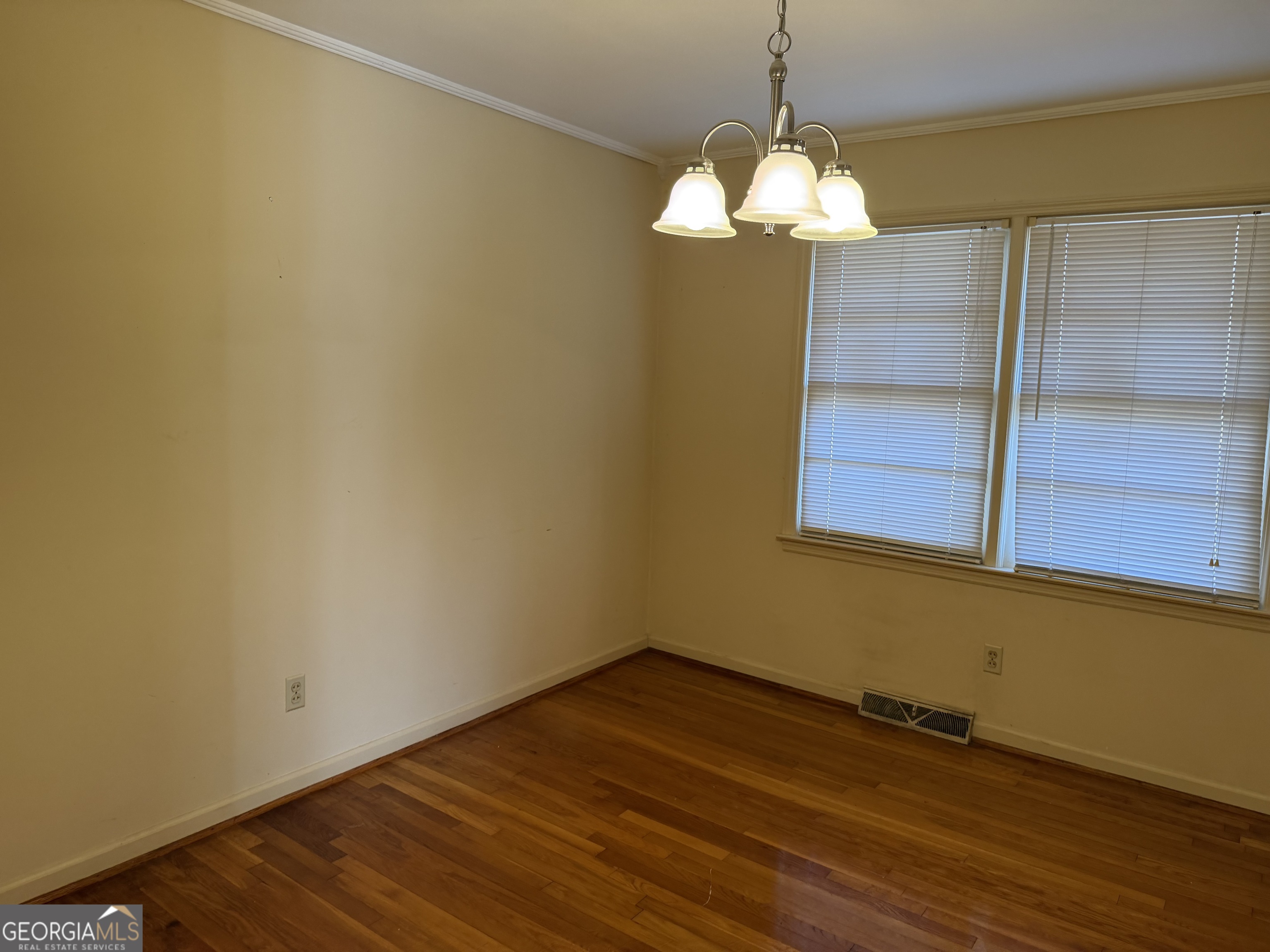 1112 Old Dalton Road Northeast Rome, GA 30165 - Photo 11 of 27 a view of a room with wooden floor and chandelier