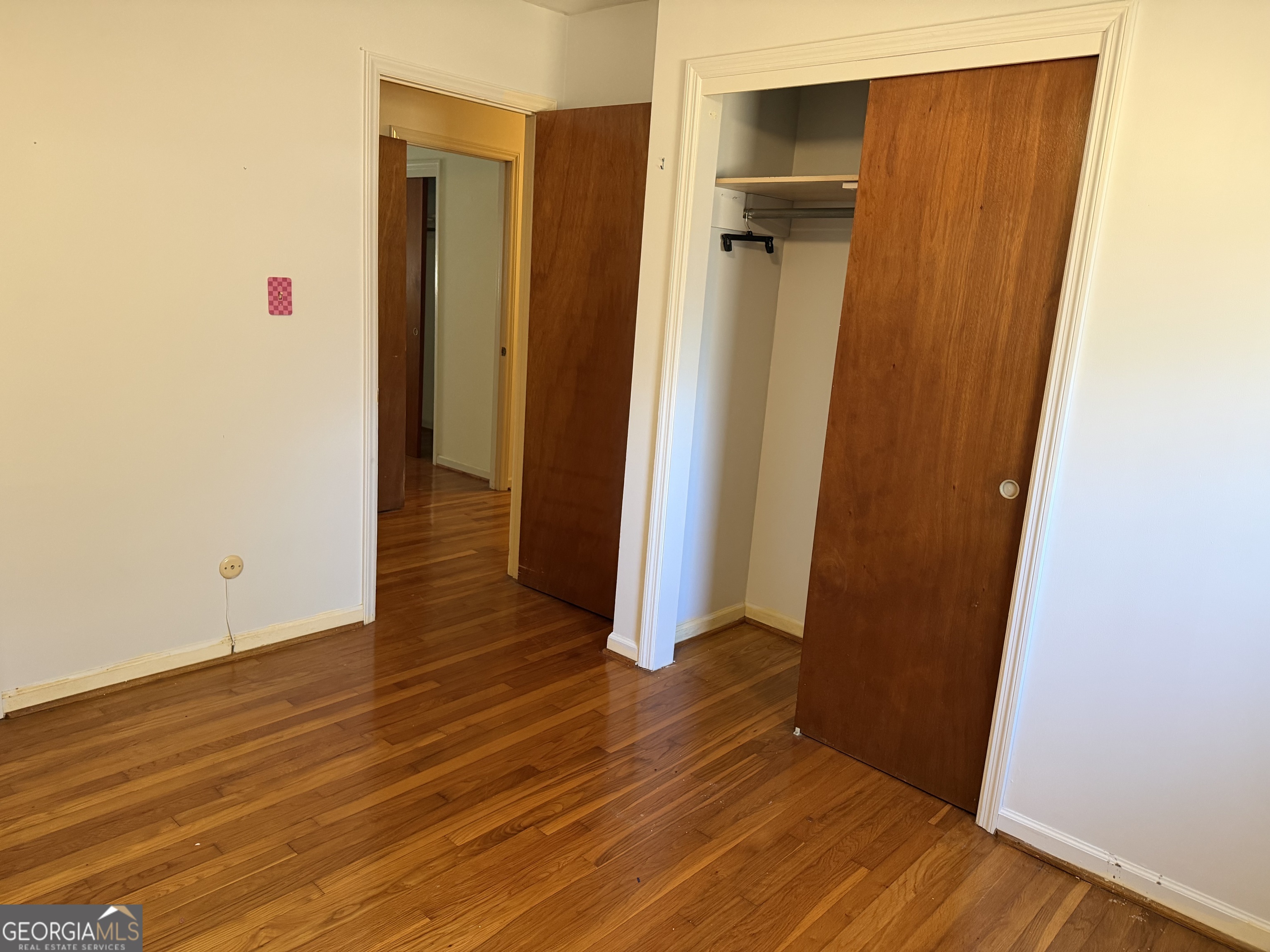 1112 Old Dalton Road Northeast Rome, GA 30165 - Photo 17 of 27 an empty room with wooden floor and closet