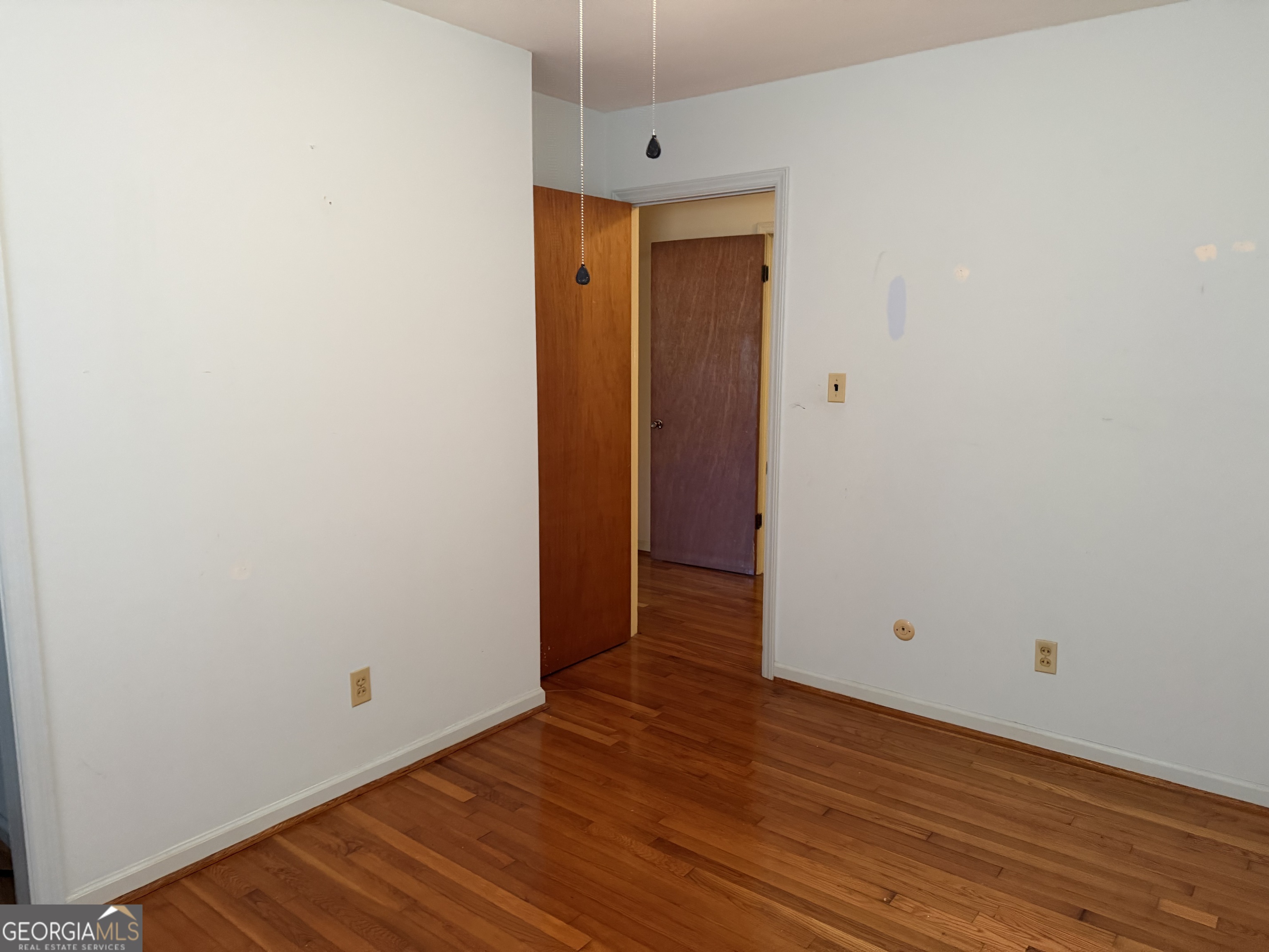 1112 Old Dalton Road Northeast Rome, GA 30165 - Photo 19 of 27 a view of an empty room with wooden floor