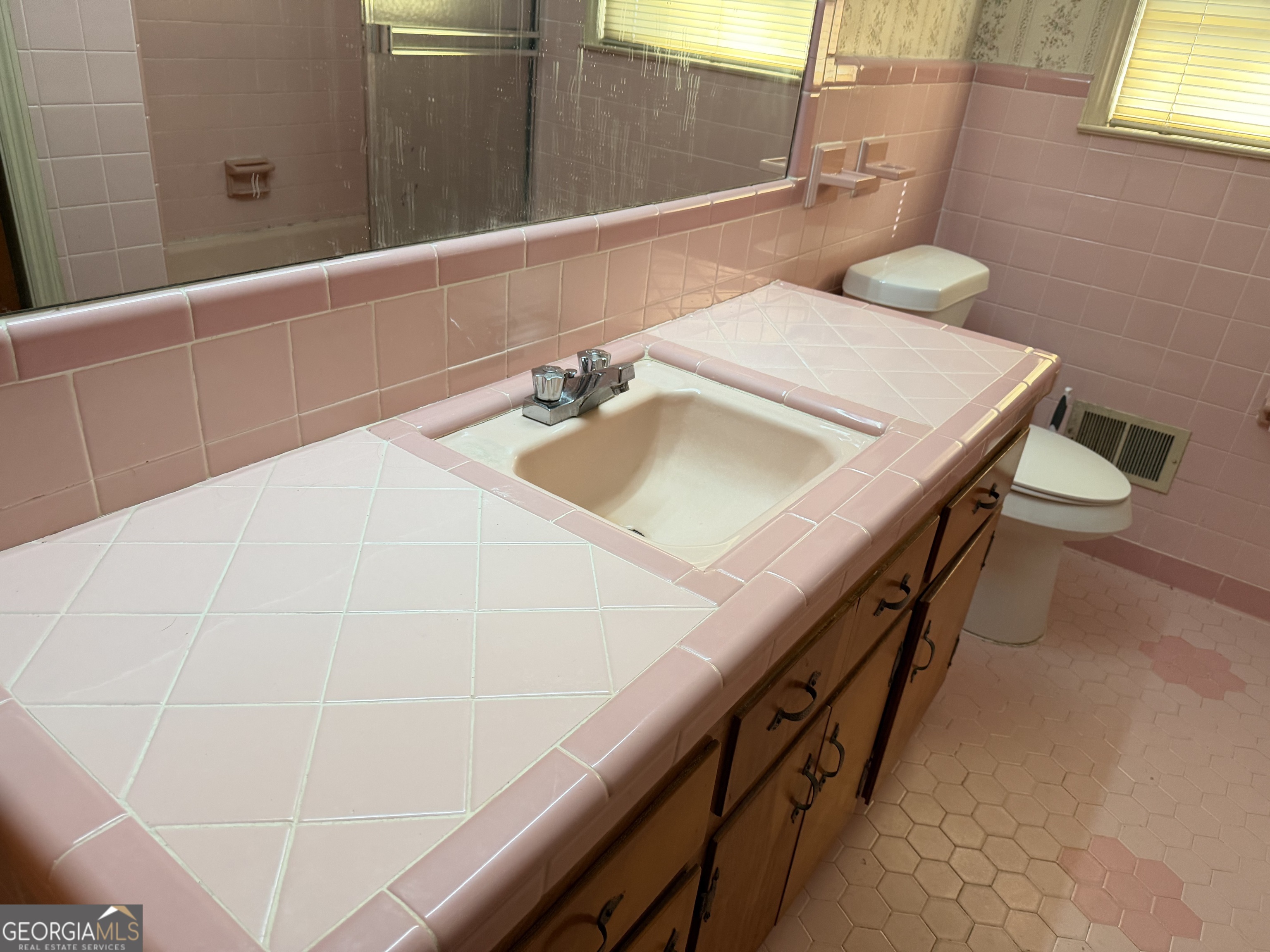 1112 Old Dalton Road Northeast Rome, GA 30165 - Photo 21 of 27 a bathroom with a sink and a mirror