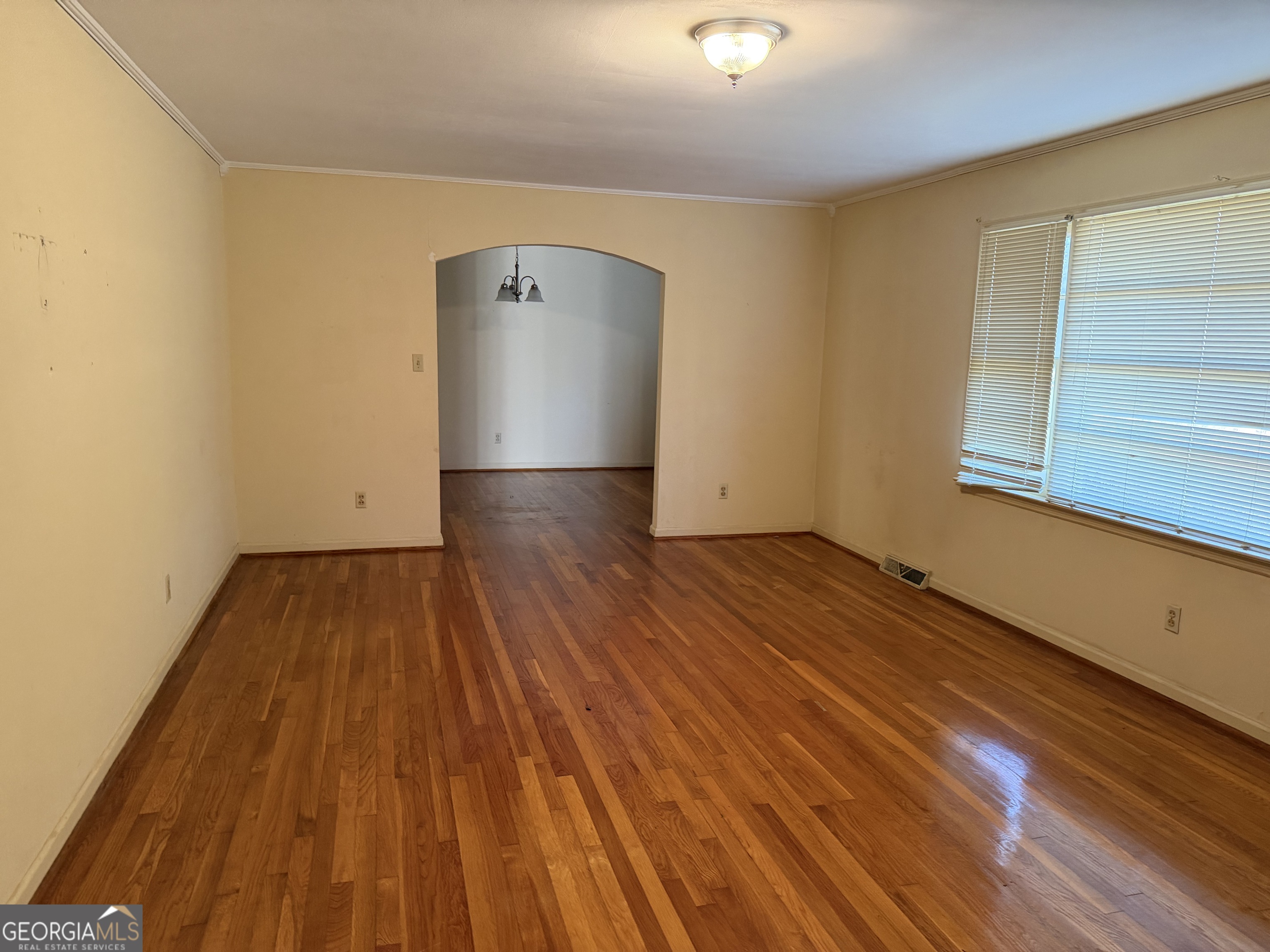 1112 Old Dalton Road Northeast Rome, GA 30165 - Photo 3 of 27 an empty room with wooden floor and windows