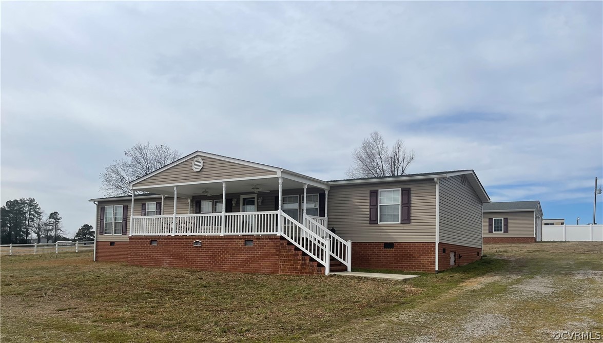 16418 Hudgins Road Dewitt, VA 23840 - Photo 1 of 50 a front view of a house with a yard