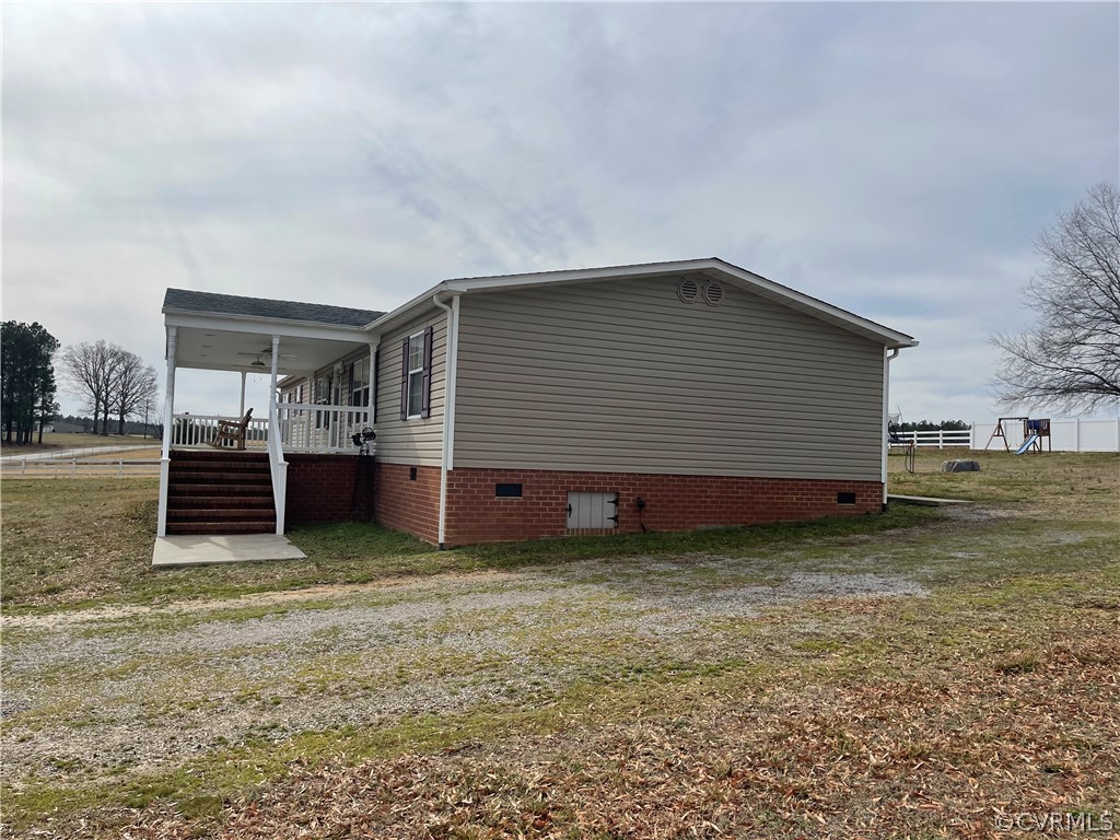 16418 Hudgins Road Dewitt, VA 23840 - Photo 4 of 50 a view of a house with backyard