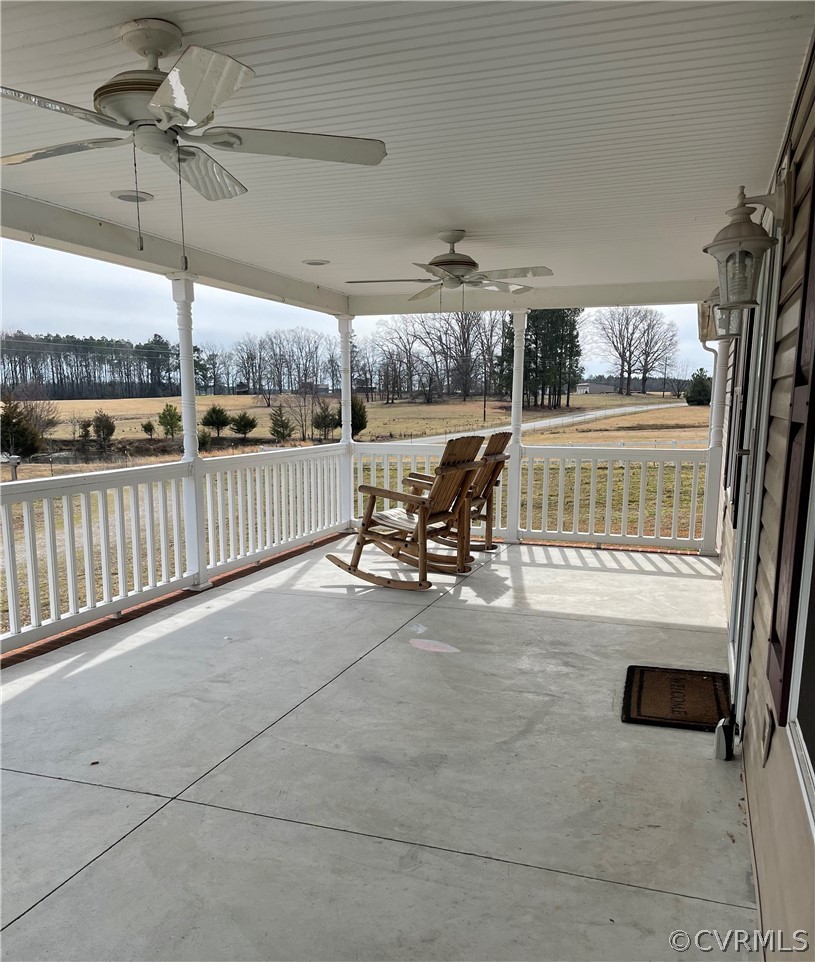 16418 Hudgins Road Dewitt, VA 23840 - Photo 6 of 50 a view of a patio with table and chairs