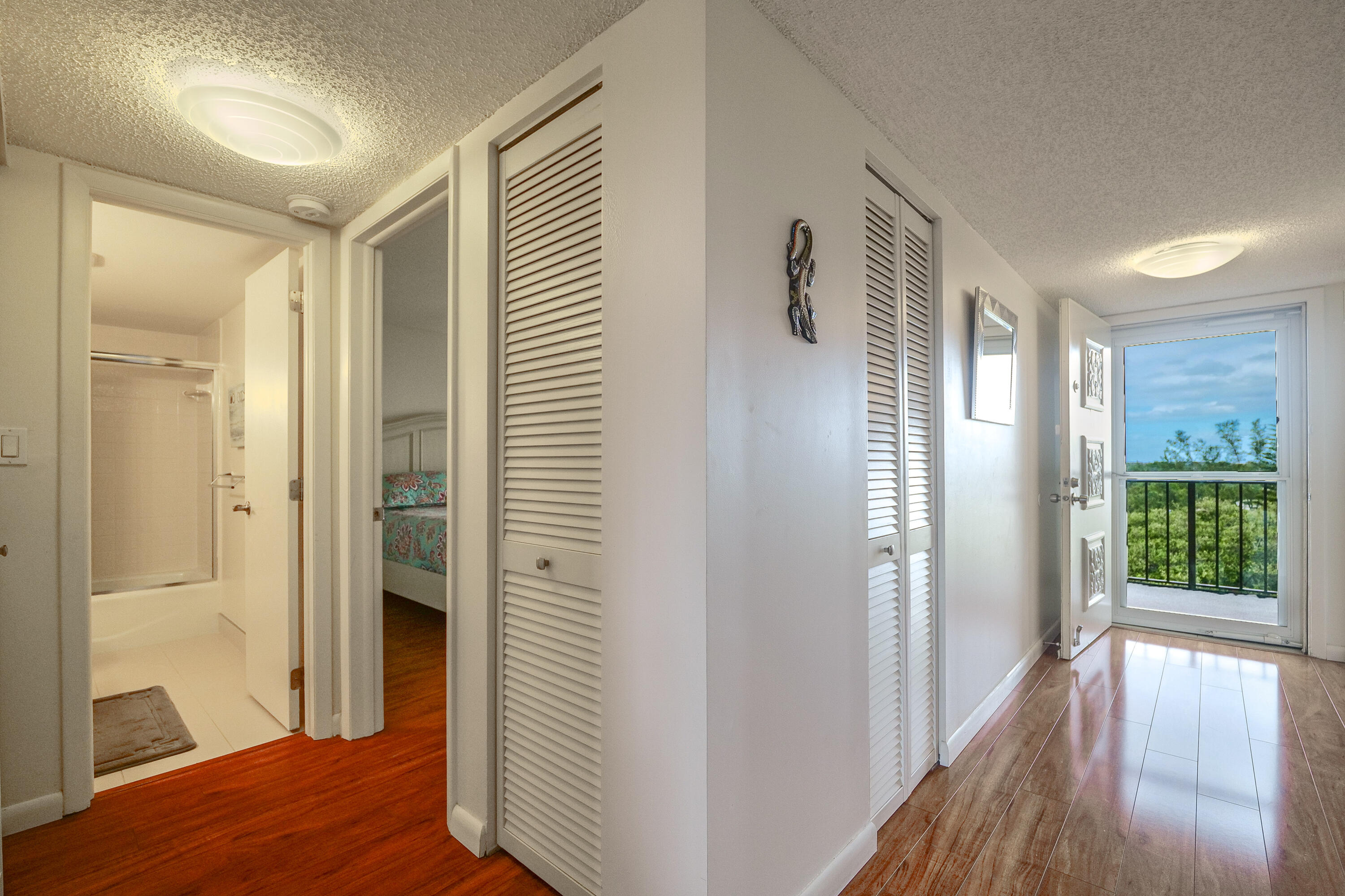 3930 Inverrary Boulevard, Unit 703D Lauderhill, FL 33319 - Photo 19 of 62 a view of entryway with bedroom and wooden floor