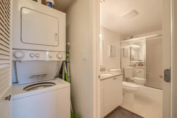 a bedroom with a bed couch and a window