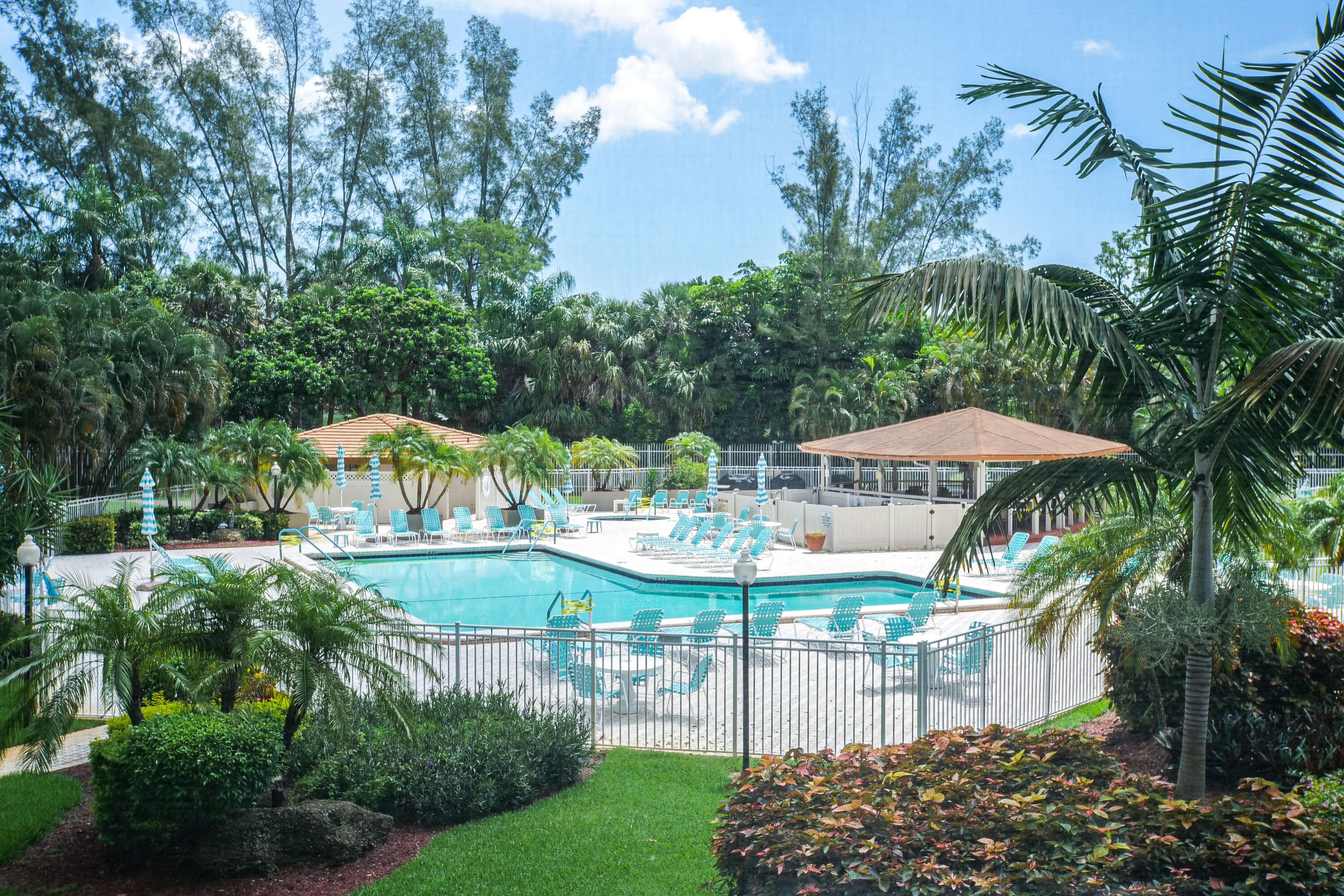 3930 Inverrary Boulevard, Unit 703D Lauderhill, FL 33319 - Photo 55 of 62 a view of a house with a yard and garden