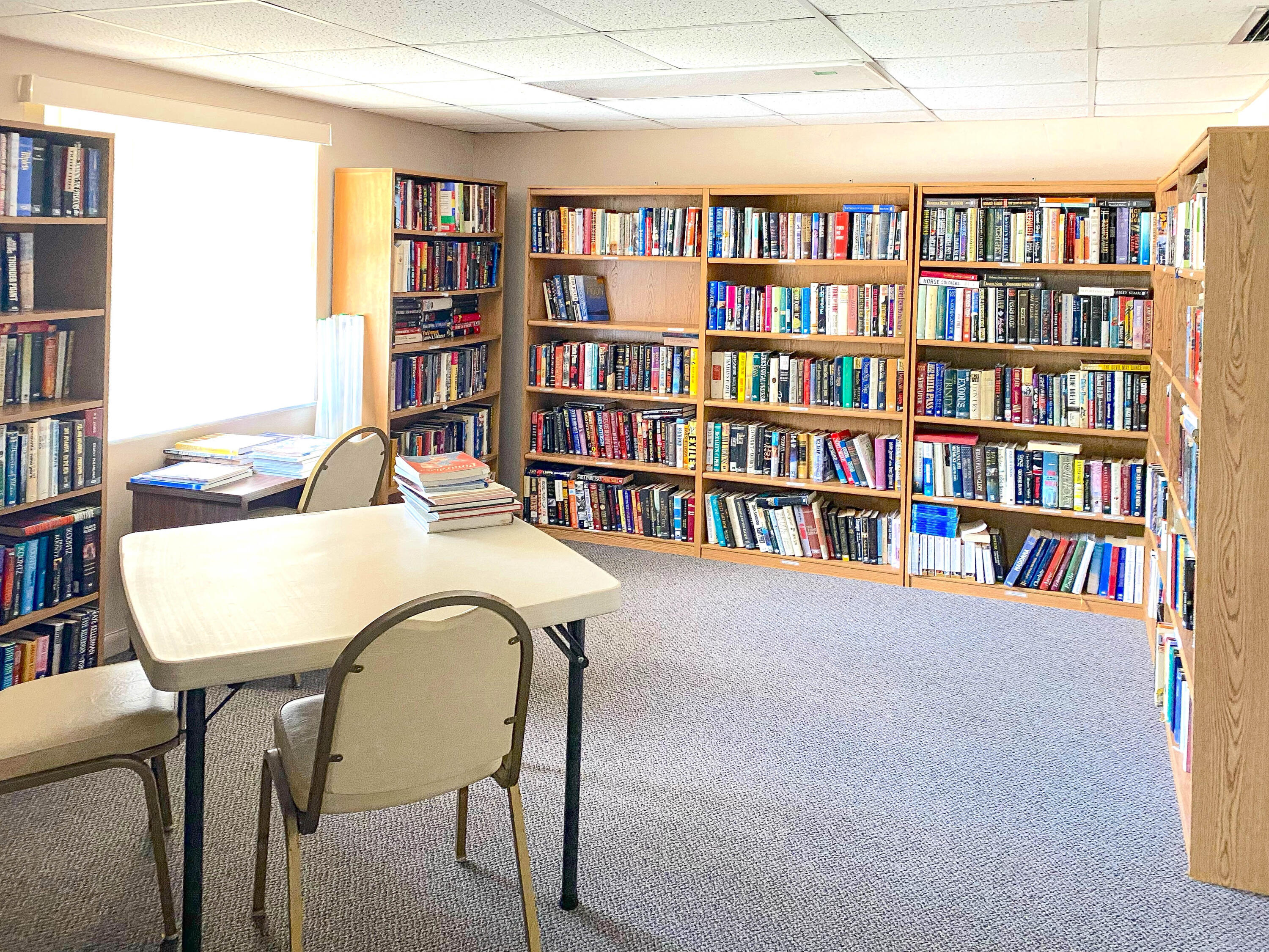 3930 Inverrary Boulevard, Unit 703D Lauderhill, FL 33319 - Photo 58 of 62 a view of a workspace with furniture and a bookshelf