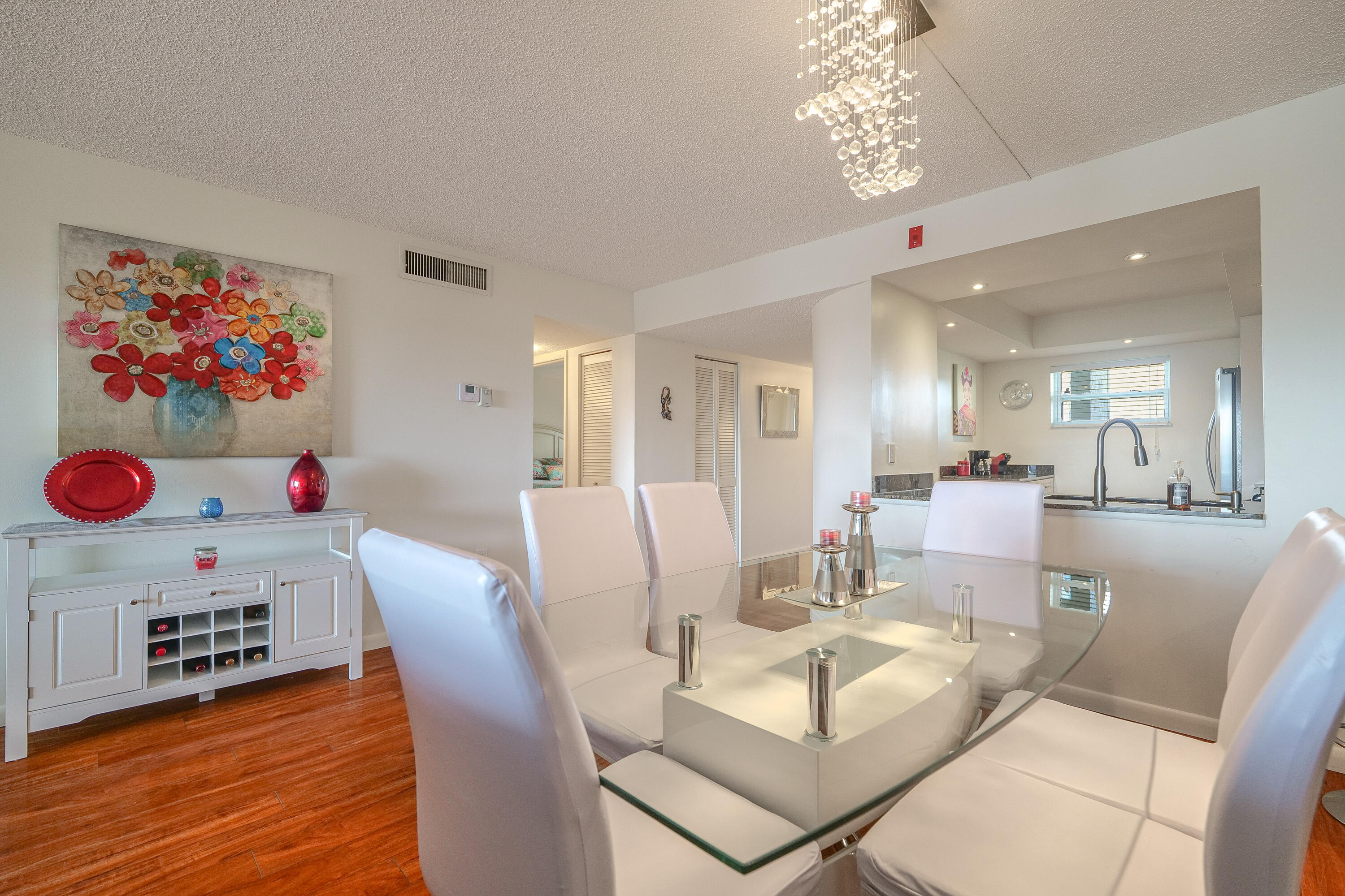 3930 Inverrary Boulevard, Unit 703D Lauderhill, FL 33319 - Photo 7 of 62 a view of a dining room with furniture and wooden floor