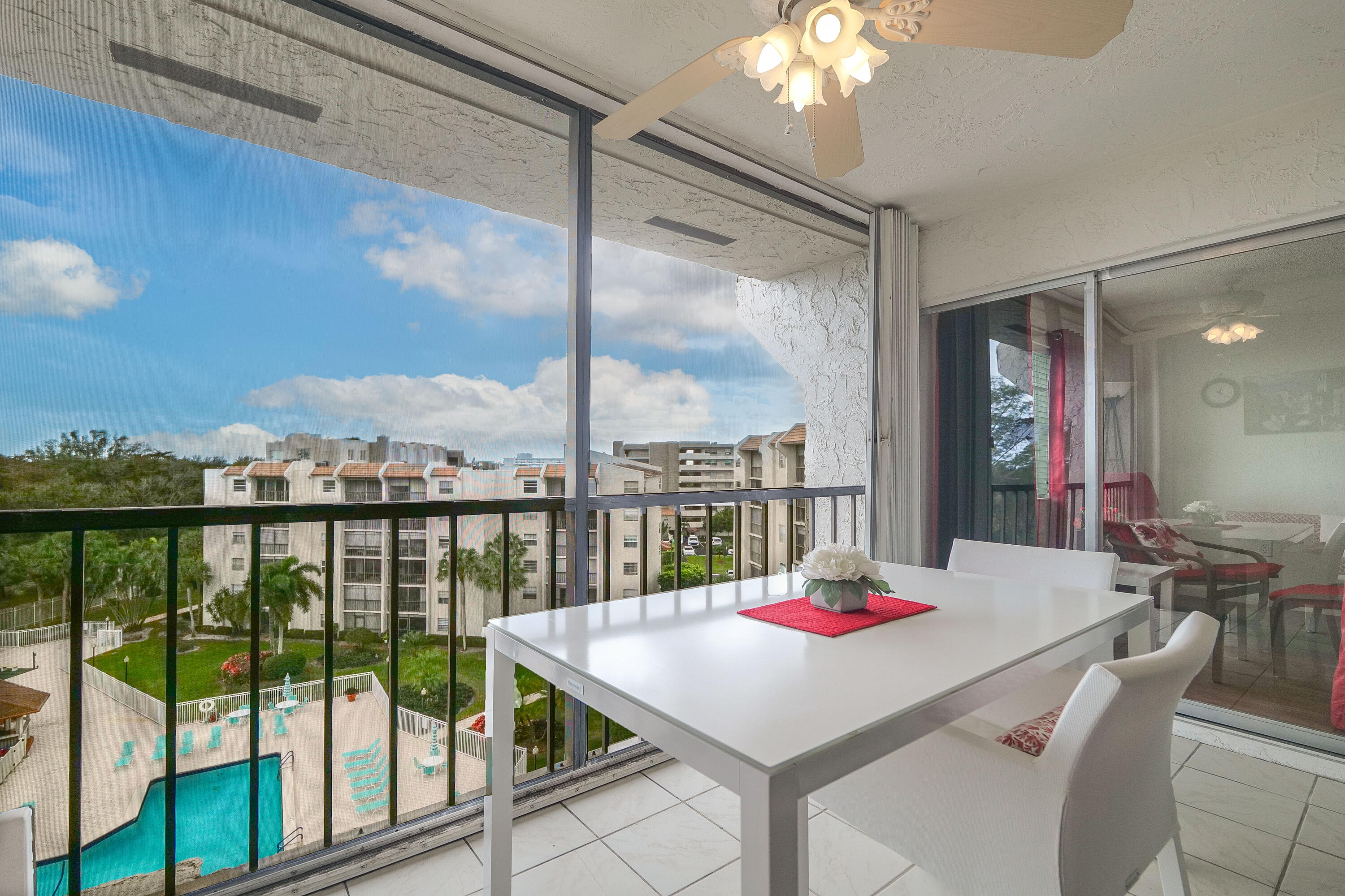 3930 Inverrary Boulevard, Unit 703D Lauderhill, FL 33319 - Photo 10 of 62 a room with pool table and a chandelier