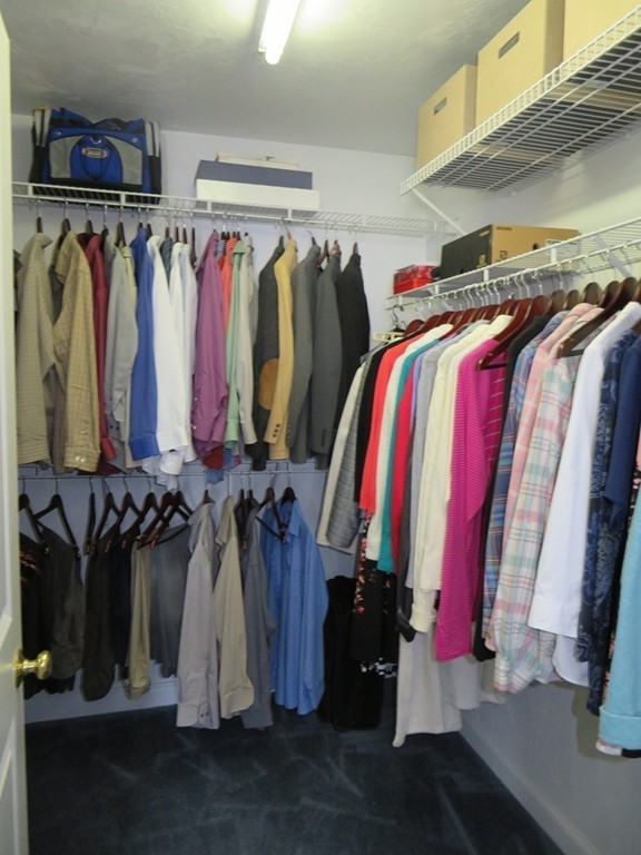 7 Strawberry Lane, Unit A Hudson, MA 01749 - Photo 12 of 20 a view of walk in closet with clothes