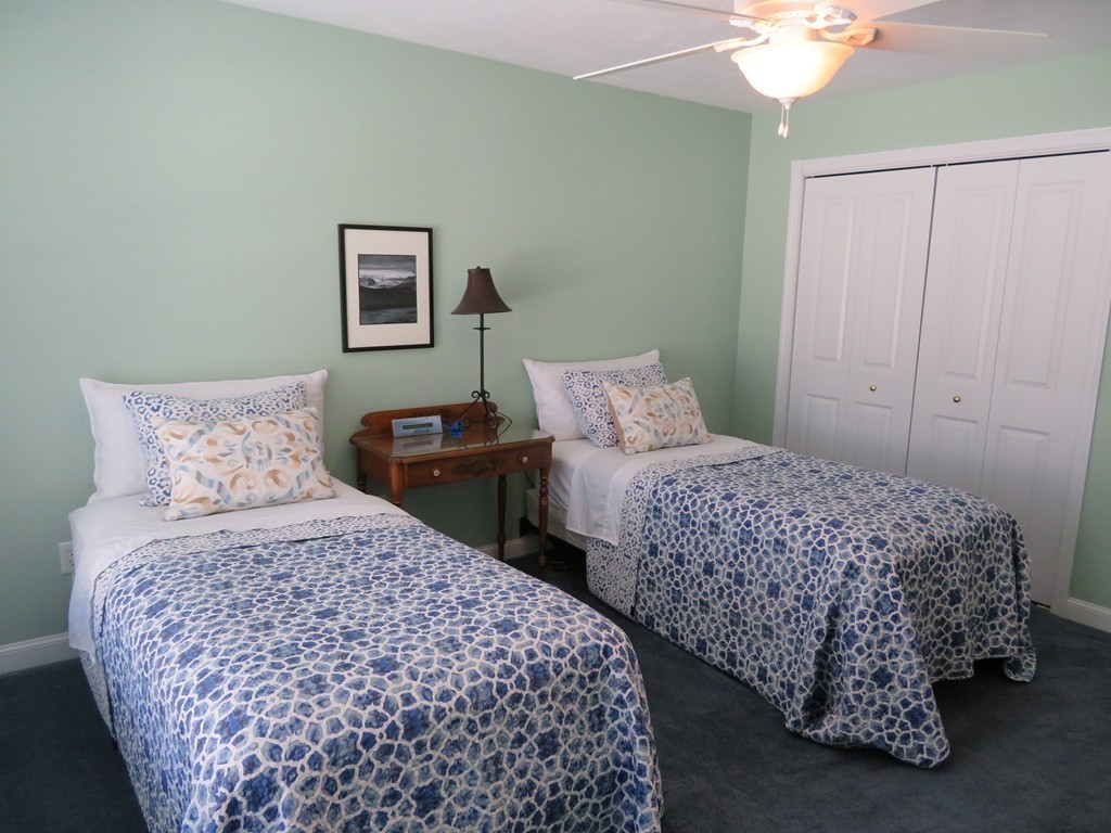 7 Strawberry Lane, Unit A Hudson, MA 01749 - Photo 13 of 20 a bedroom with two beds and a lamp