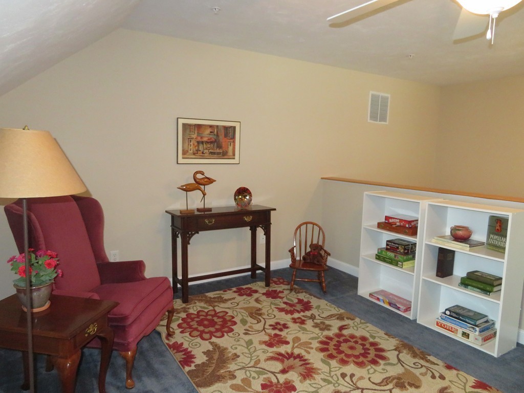 7 Strawberry Lane, Unit A Hudson, MA 01749 - Photo 16 of 20 a room with furniture and a rug