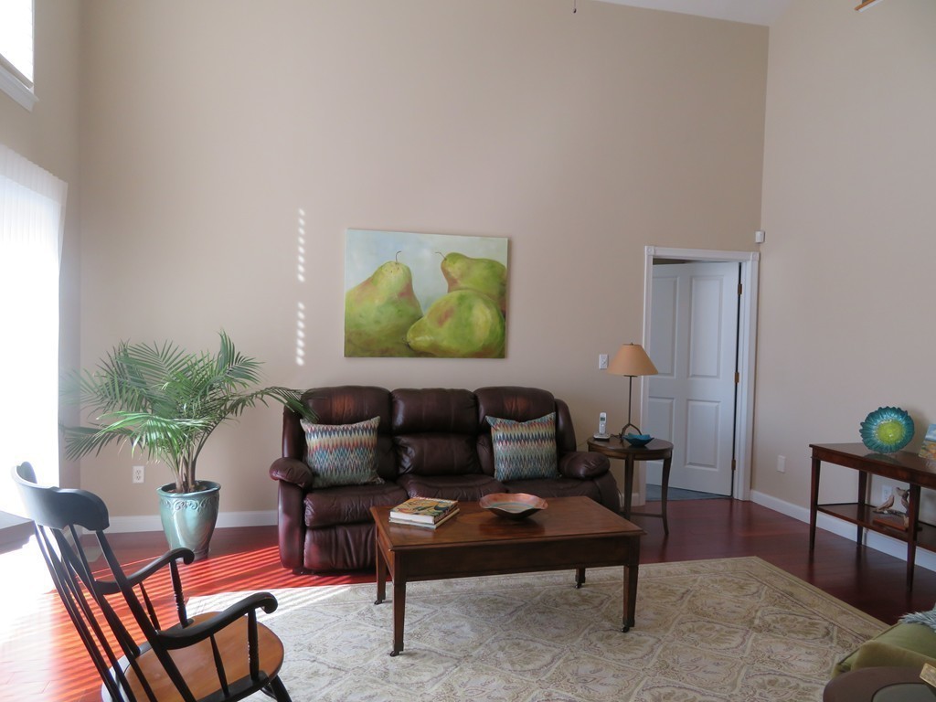 7 Strawberry Lane, Unit A Hudson, MA 01749 - Photo 7 of 20 a living room with furniture and a rug