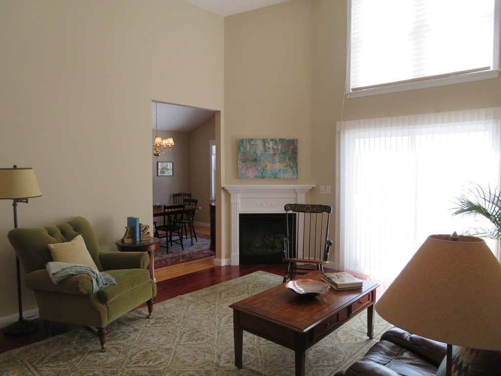 7 Strawberry Lane, Unit A Hudson, MA 01749 - Photo 8 of 20 a living room with furniture and a fireplace