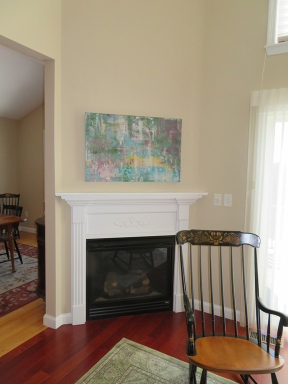 7 Strawberry Lane, Unit A Hudson, MA 01749 - Photo 9 of 20 a living room with furniture and a fireplace