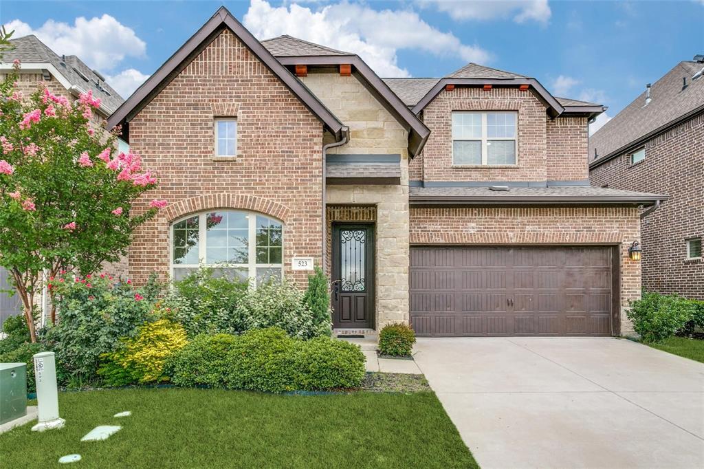 523 Paddock Way Irving, TX 75039 - Photo 1 of 23 a front view of a house with a garden and plants