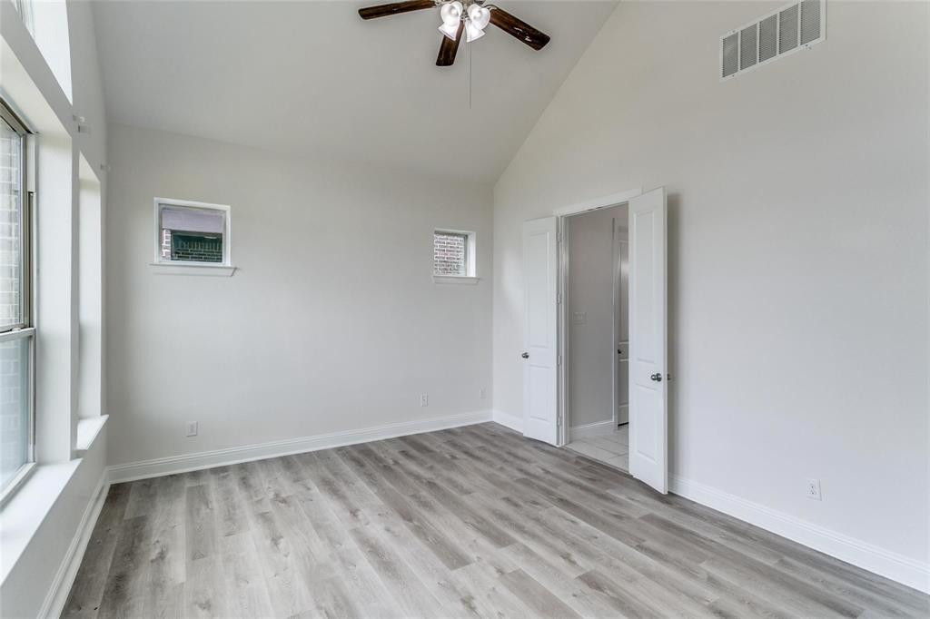 523 Paddock Way Irving, TX 75039 - Photo 12 of 23 wooden floor in an empty room with a window