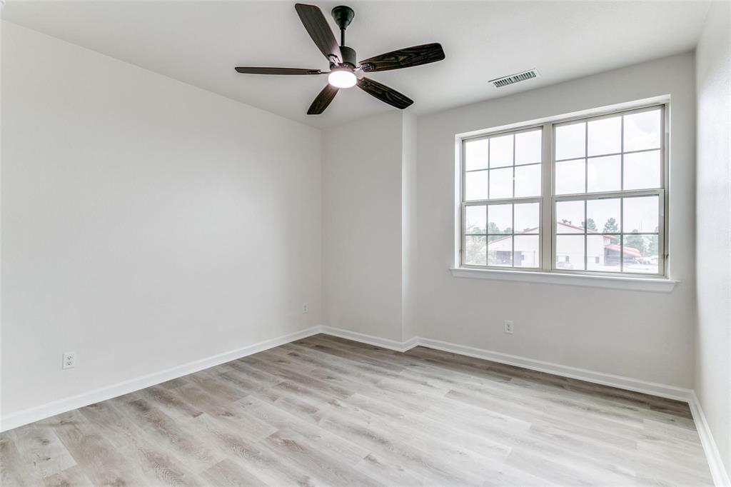 523 Paddock Way Irving, TX 75039 - Photo 20 of 23 an empty room with a window and a fan