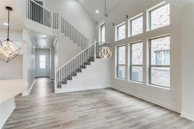 a view of an entryway with wooden floor