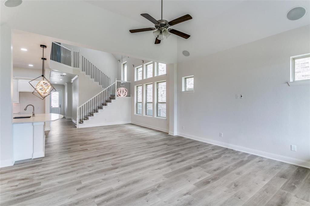 523 Paddock Way Irving, TX 75039 - Photo 6 of 23 wooden floor in an empty room with a window