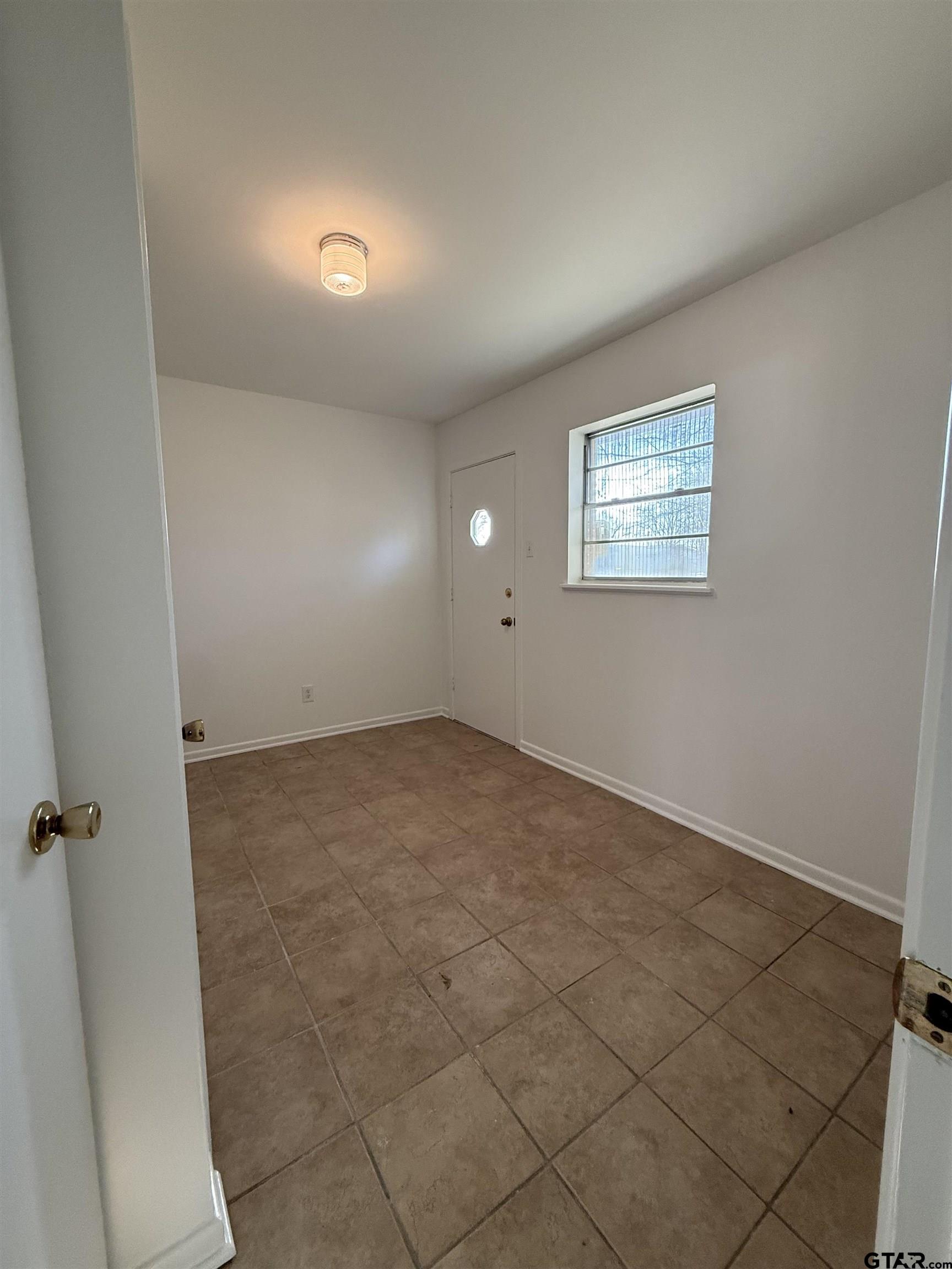 1785 Rollin Road Canton, TX 75103 - Photo 7 of 12 an empty room with a workbench