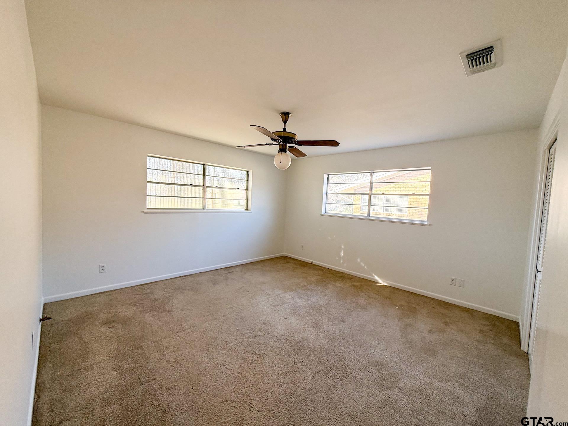 1785 Rollin Road Canton, TX 75103 - Photo 10 of 12 a view of a livingroom with a ceiling fan and window