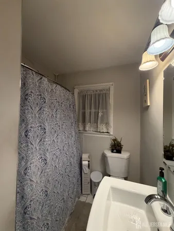 a bathroom with a bathtub sink and toilet