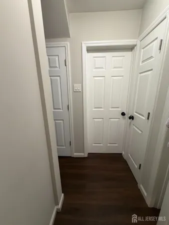 an empty room with wooden floor